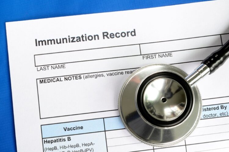 picture of an immunization record with a stethoscope
