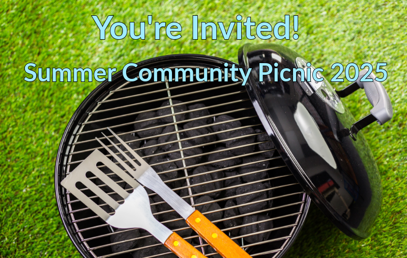 Graphic reading "You're Invited! Summer Community Picnic 2025" over a photo of an open charcoal grill with a spatula and fork resting on the grate, set on grass.